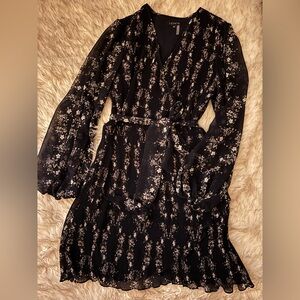 Navy blue long sleeve pleated dress.